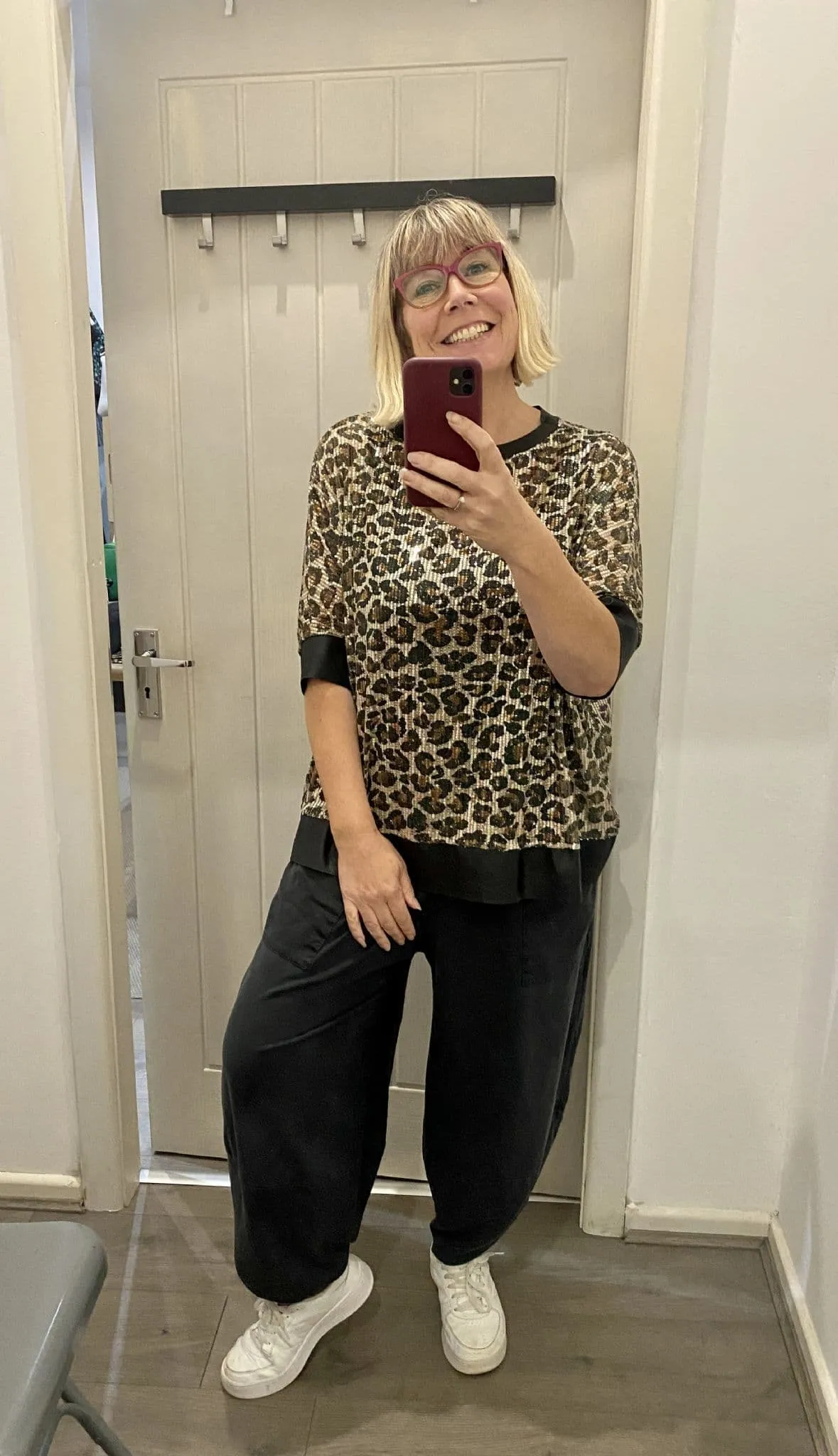 LEOPARD PRINT SEQUIN TOP WITH FAUX LEATHER DETAIL