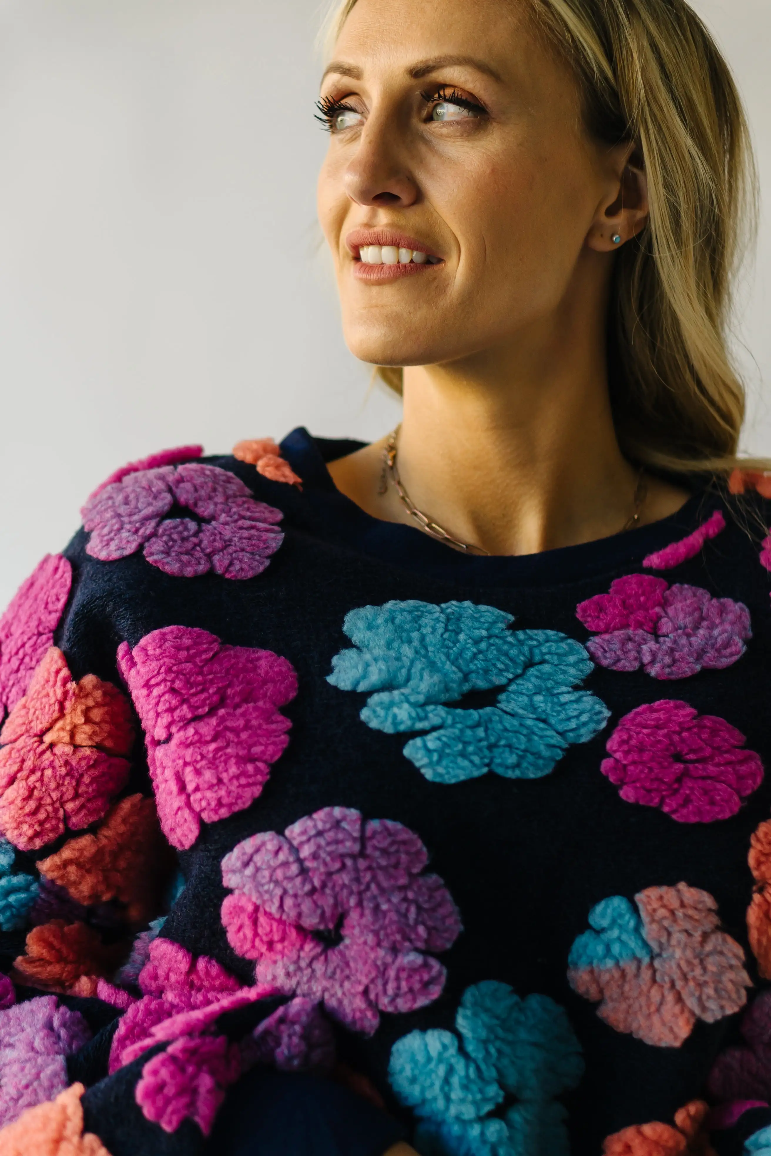 The Flanagan Sherpa Flower Detail Sweater in Navy + Fuchsia